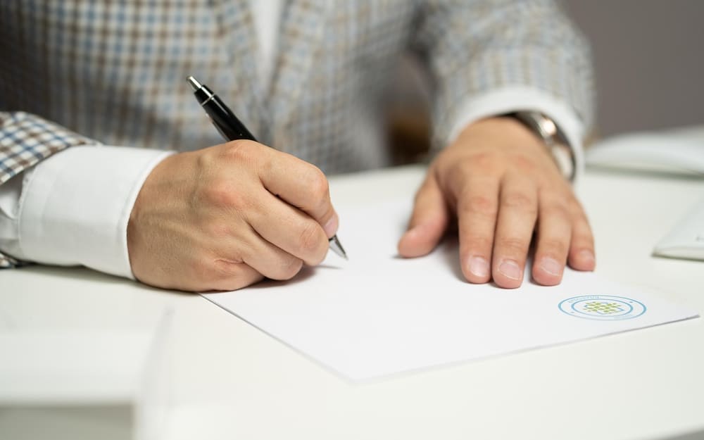 Photo: Man, sign, paper, write, document